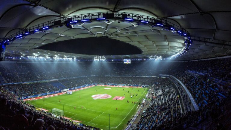 Champions League predictions tonight: a floodlit football stadium at night (stock photo, not a Champions League venue)