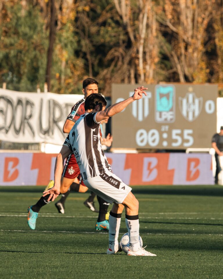 Stock photograph of a soccer match on a sunny day, used to illustrate handicap betting; not a photo of any match or team mentioned on this page